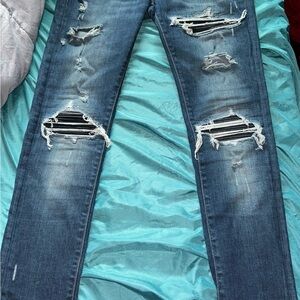 Distressed Amiri Blue Jeans